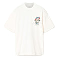 An off-white short-sleeve crewneck t-shirt featuring a colorful graphic print on the left chest with a cartoon character, rainbow, and palm trees, displayed on a clean white background.
