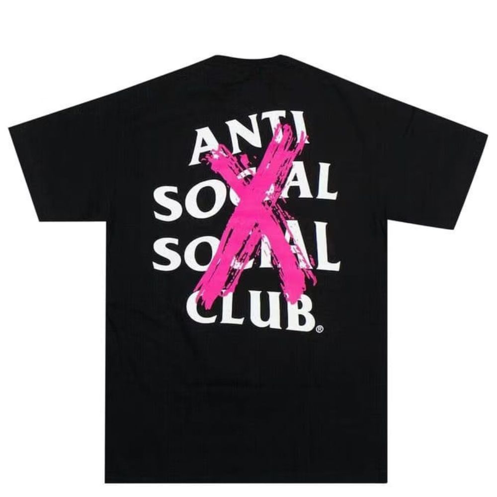 A black short-sleeve t-shirt with a large graphic on the back featuring the text 'ANTI SOCIAL SOCIAL CLUB' in white and a bold pink paint-splattered 'X' overlay.