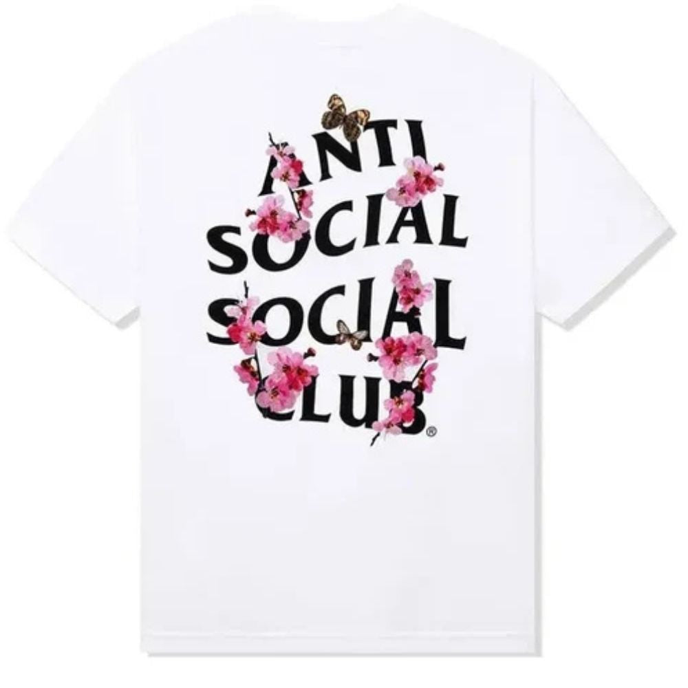 White short-sleeve T-shirt with a large front graphic reading 'ANTI SOCIAL SOCIAL CLUB' in black letters, overlaid with pink cherry blossoms and small butterflies, on a plain white background.