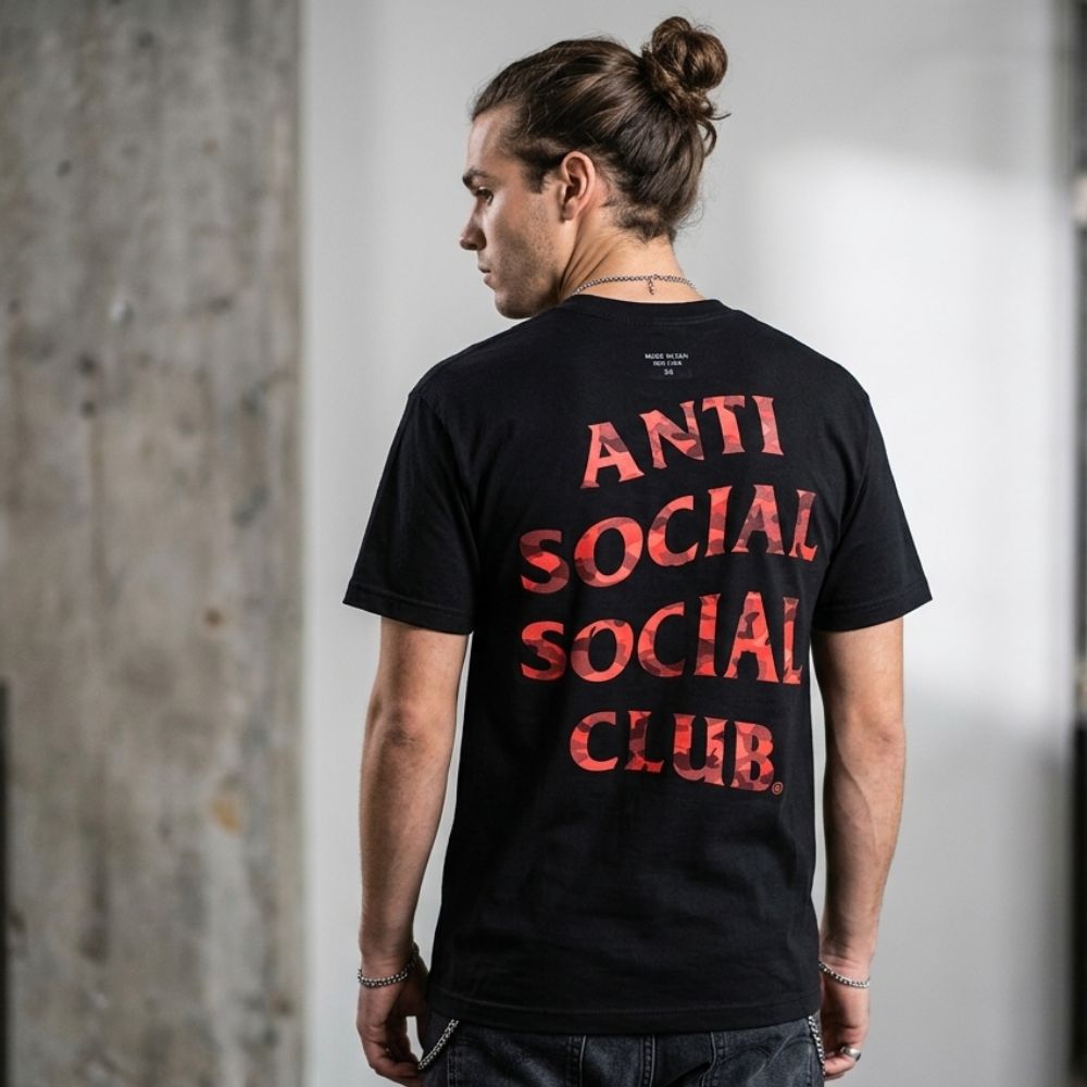 A black short-sleeve t-shirt with 'ANTI SOCIAL SOCIAL CLUB' printed in a distressed red font on the back, shown against a plain white background.