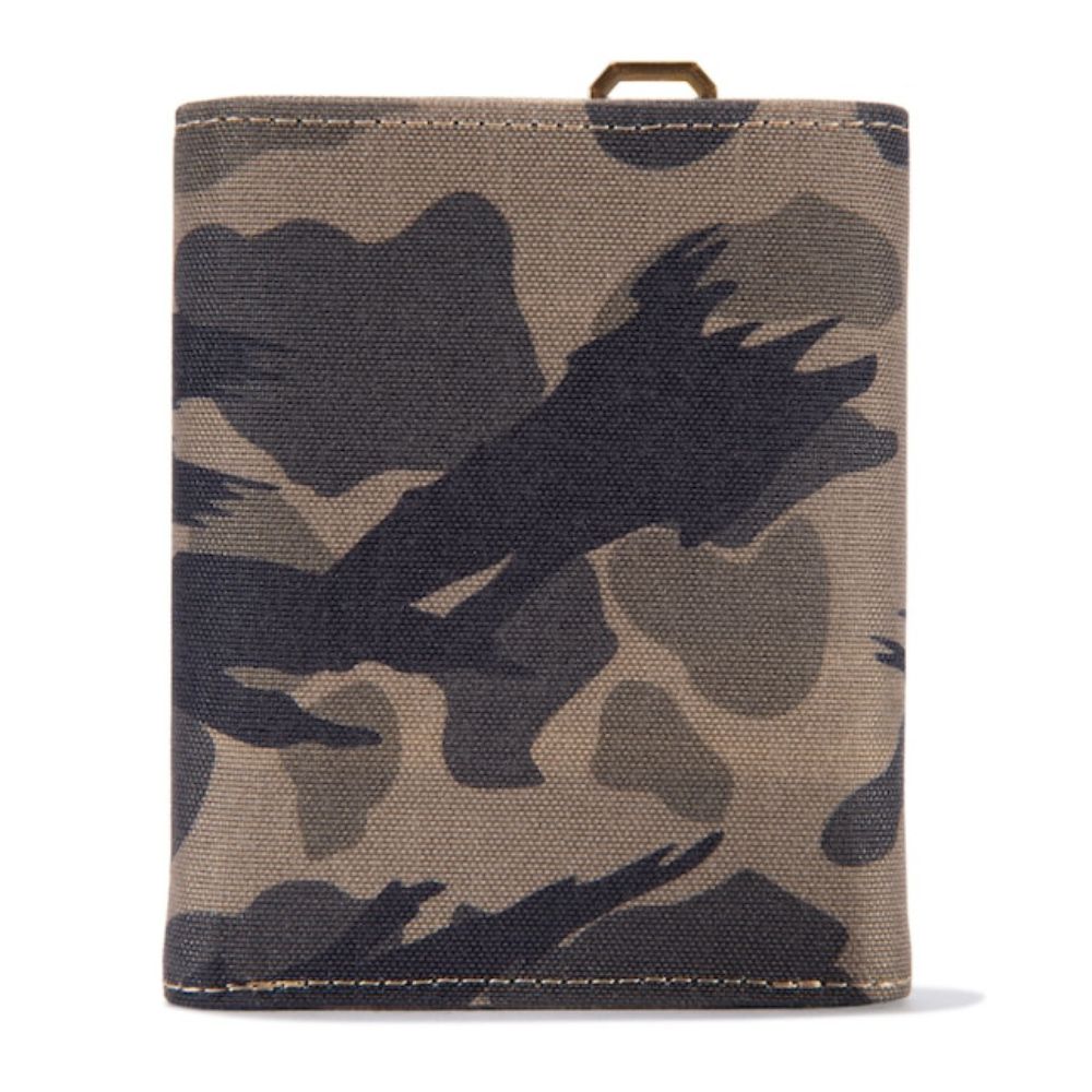 A canvas bi-fold wallet featuring a dark camouflage pattern in shades of brown, gray, and black, with a small brass ring at the top, shown on a plain white background.