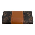 A folded wallet or clutch featuring a dark brown and black horse-drawn carriage monogram pattern with a prominent tan leather center band and white contrast stitching.