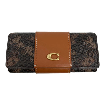 A Coach wallet in the brand's signature brown monogram canvas, featuring a tan leather center band with white contrast stitching and a gold-tone 'C' logo clasp.