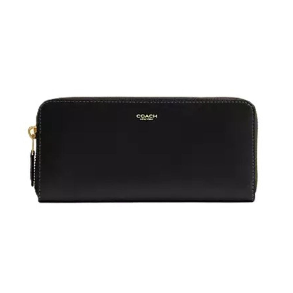 A black leather Coach zip-around wallet with gold-tone hardware and a gold logo on a plain white background.