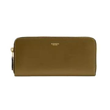 A Coach zip-around wallet in olive green leather with gold-tone hardware and a gold logo on the front, shown against a plain white background.