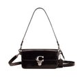 A black patent leather shoulder bag with a silver-tone 'C' logo clasp on the front flap, shown against a plain white background.