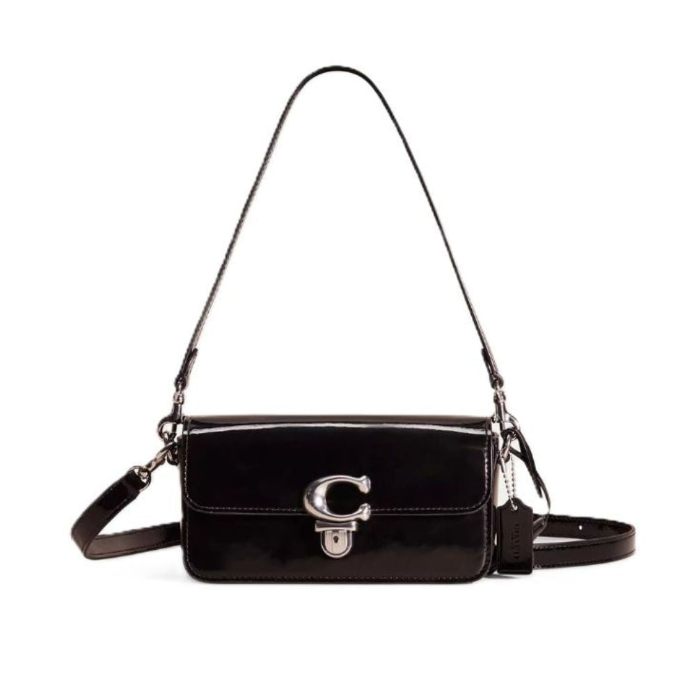 A black patent leather shoulder bag with a silver-tone 'C' logo clasp on the front flap, shown against a plain white background.