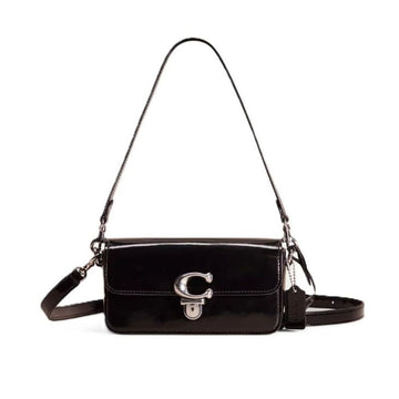 A black patent leather shoulder bag with a silver-tone 'C' logo clasp on the front flap, shown against a plain white background.