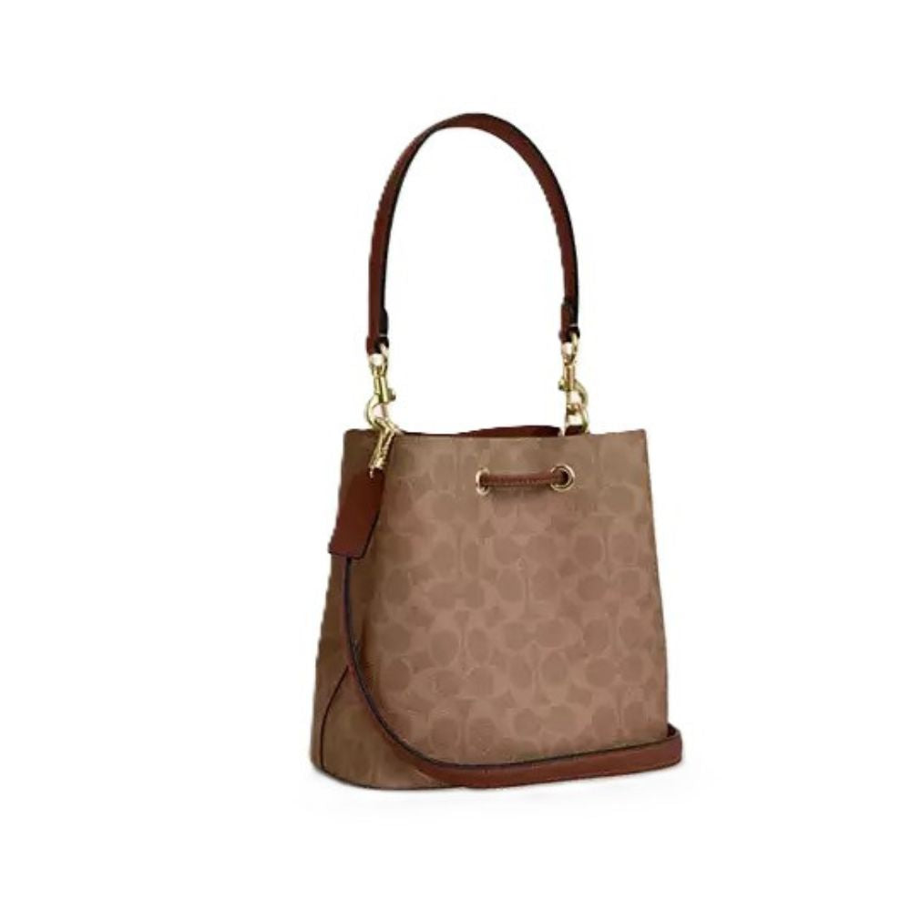 A brown and beige patterned handbag with dark brown leather trim and gold-tone hardware, shown against a plain white background.