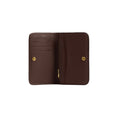 A dark brown leather wallet shown open, displaying its interior card slots, zipper compartment, and gold-tone hardware against a plain white background.