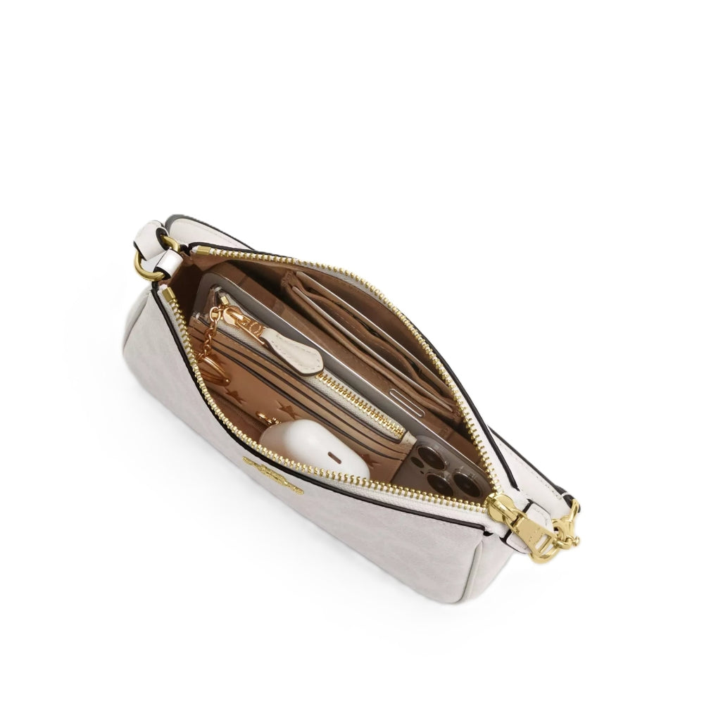 Silver handbag with gold zipper on a white background