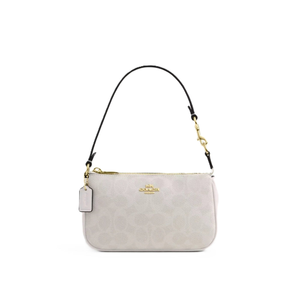 A Coach shoulder bag in light beige monogram canvas with a black leather strap and gold-tone hardware, shown against a plain white background.