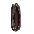 A black leather wristlet clutch with an embossed pattern, shown open to reveal a dark brown interior lining and gold-tone hardware.