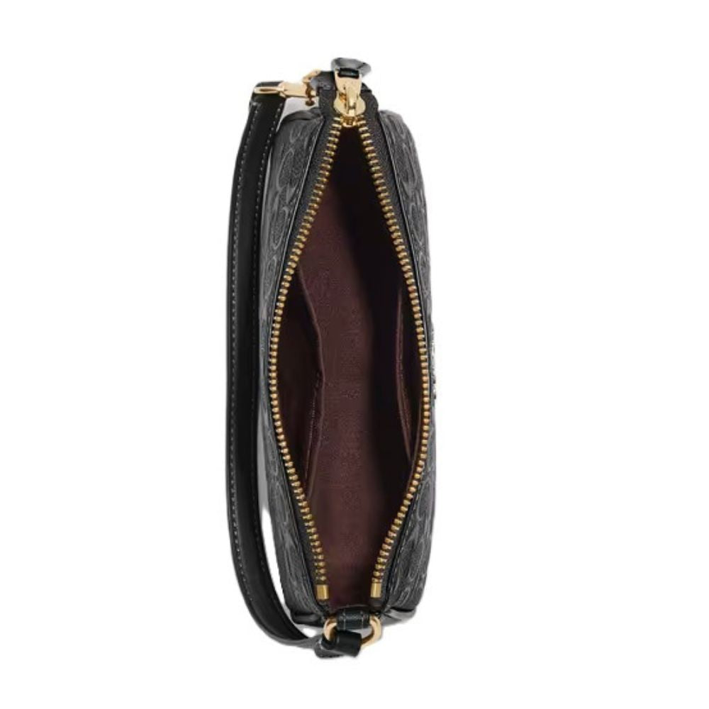 A black leather wristlet clutch with an embossed pattern, shown open to reveal a dark brown interior lining and gold-tone hardware.
