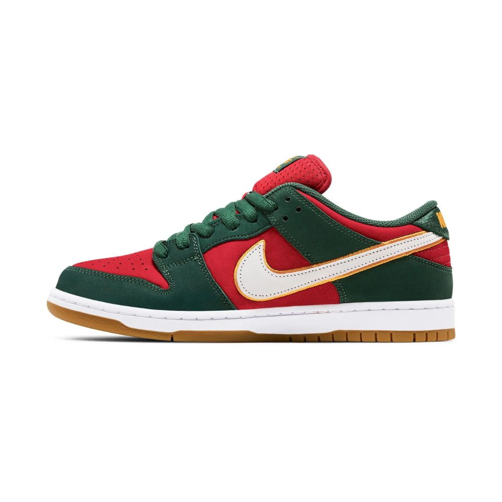 A Nike Dunk sneaker in a red and dark green colorway, featuring a white Swoosh outlined in gold, a red tongue, and a brown gum sole, shown against a plain white background.