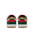 A pair of Nike Dunk Low sneakers shown from the back, featuring green, red, and yellow overlays with a white midsole and a gum outsole.