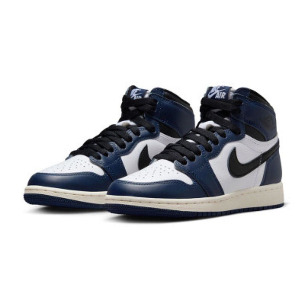 A pair of Nike Air Jordan 1 High sneakers in navy blue, white, and black, displayed against a clean white background.