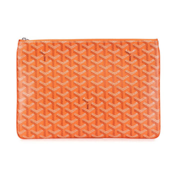 An orange Goyardine zip pouch featuring the brand's signature repeating chevron pattern in orange and white, shown against a plain white background.