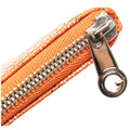 Close-up of an orange woven fabric zipper pouch with a shiny silver metal zipper and pull tab on a white background.