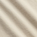 Close-up of beige fabric with subtle texture