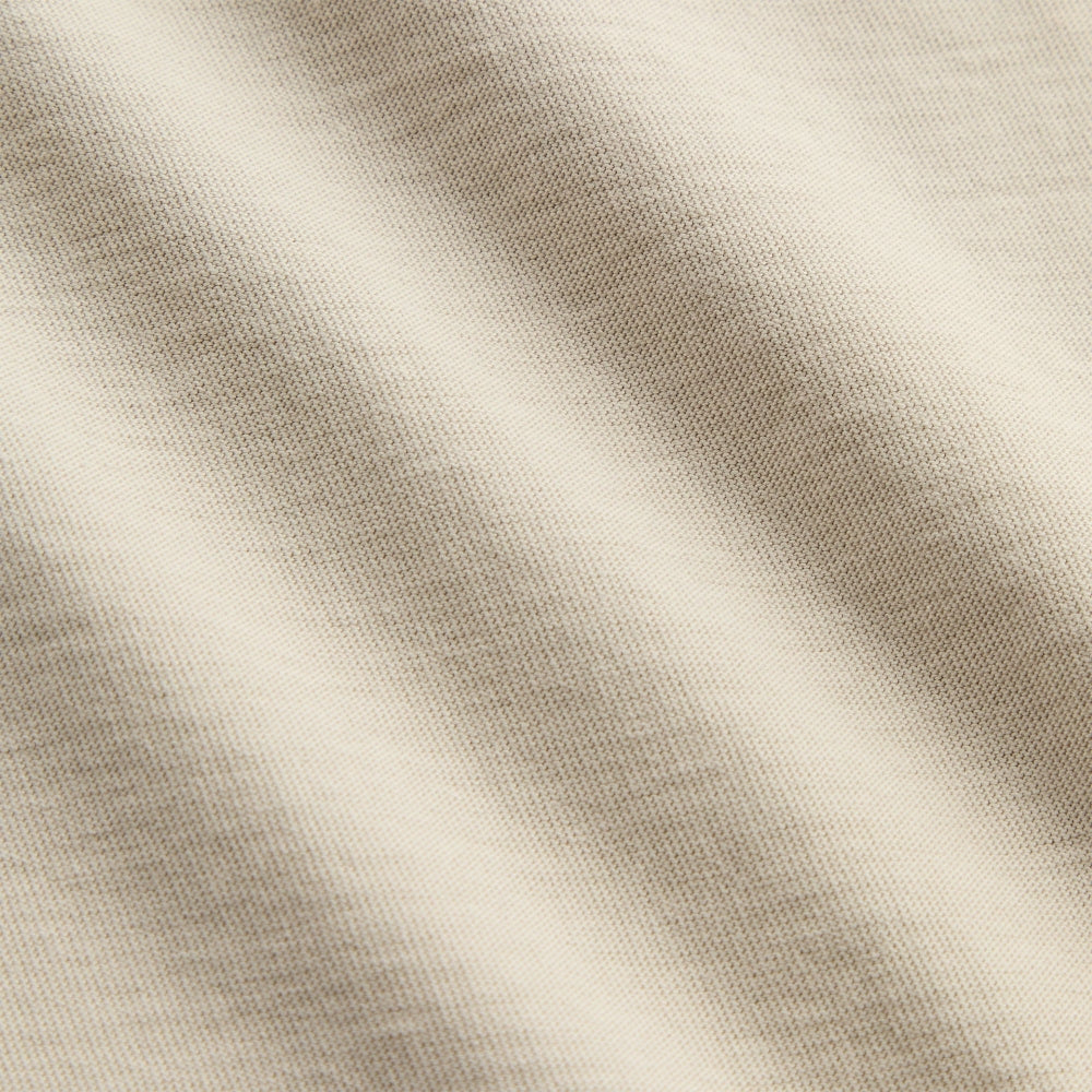 Close-up of beige fabric with subtle texture