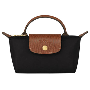A black nylon handbag with a brown leather top handle, zipper trim, and front flap featuring a gold-tone circular logo button.