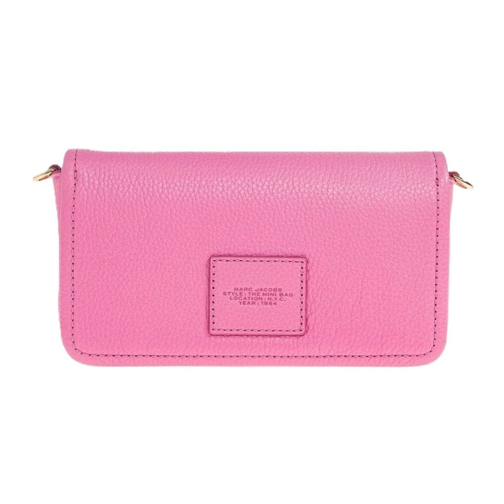A pink pebbled leather crossbody wallet by Marc Jacobs, featuring a rectangular front pocket with an embossed brand patch and gold-tone hardware on the sides, shown against a plain white background.
