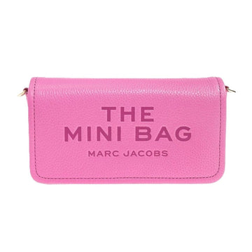A pink pebbled leather mini wallet by Marc Jacobs, featuring the text 'THE MINI BAG' and 'MARC JACOBS' embossed on the front, set against a plain white background.