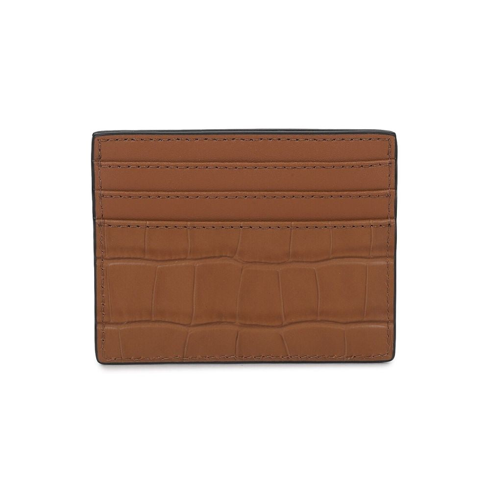 A brown leather card holder with an alligator or crocodile-embossed texture on the front and smooth leather card slots on the back, shown on a plain white background.