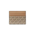 Michael Kors monogram canvas card holder wallet in beige and brown, featuring a tan leather stripe detail at the top, shown on a plain white background.