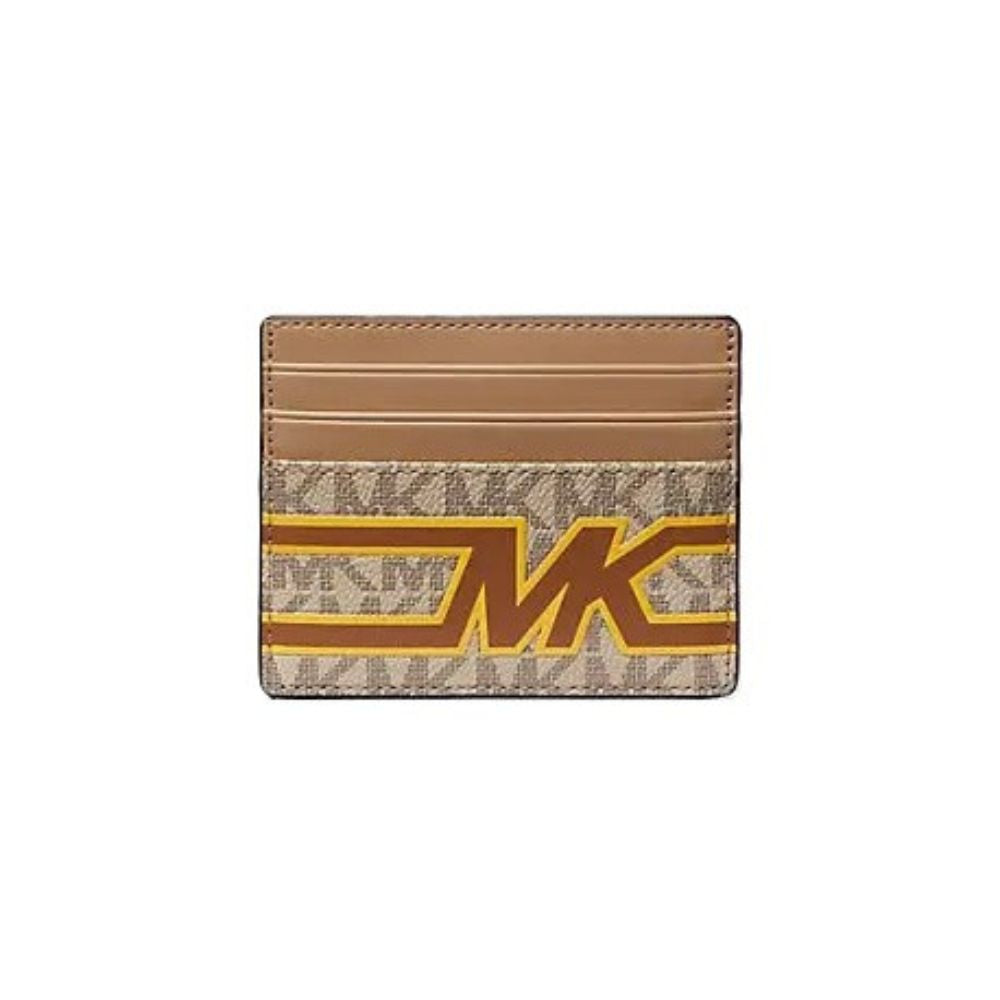 A Michael Kors cardholder wallet featuring a tan leather top section and a beige monogram patterned lower section with a large brown and gold 'MK' logo.