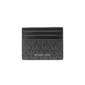 A black Michael Kors card holder wallet featuring the brand's signature monogram pattern and 'MICHAEL KORS' text in white on the front, set against a plain white background.