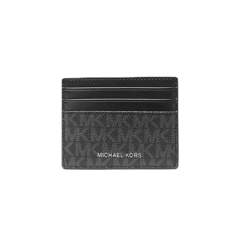 A black Michael Kors card holder wallet featuring the brand's signature monogram pattern and 'MICHAEL KORS' text in white on the front, set against a plain white background.