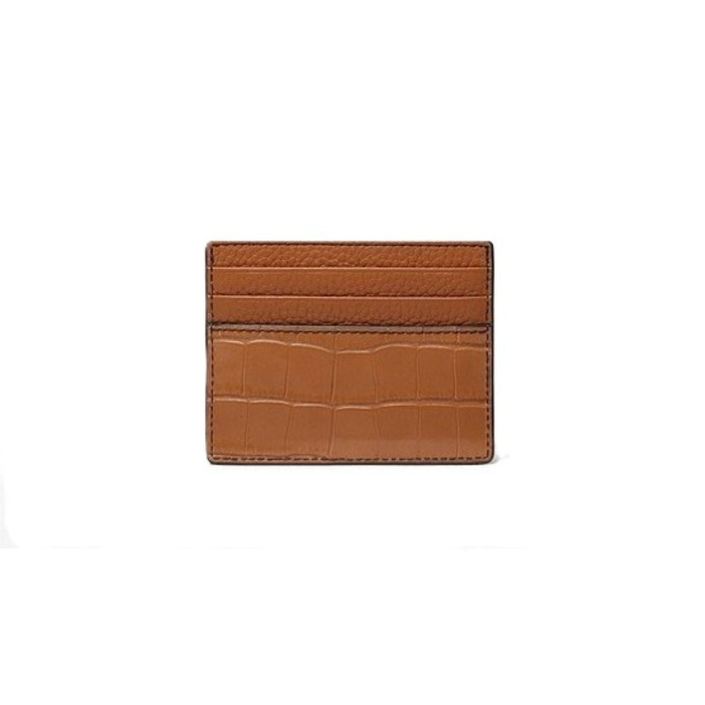 A slim brown leather card holder with a textured top panel and an embossed crocodile pattern bottom, shown on a plain white background.