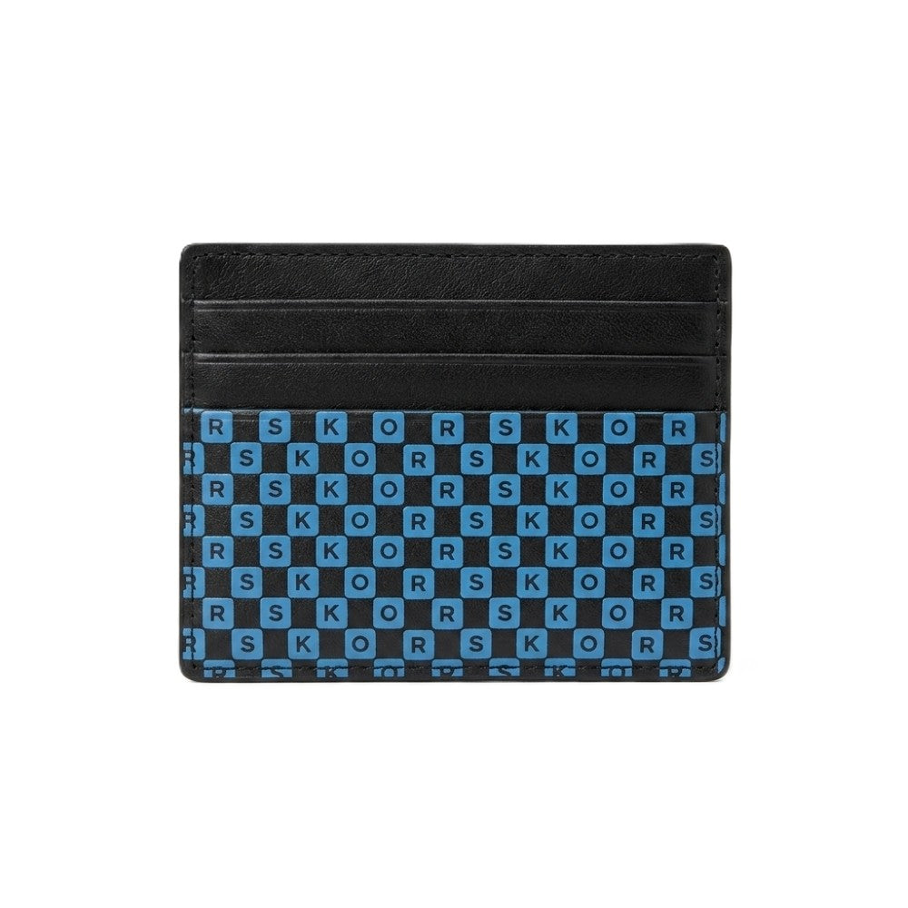 A black leather card holder wallet featuring a blue and black checkered pattern on the lower half with the brand name 'KORS' printed in white on each square.