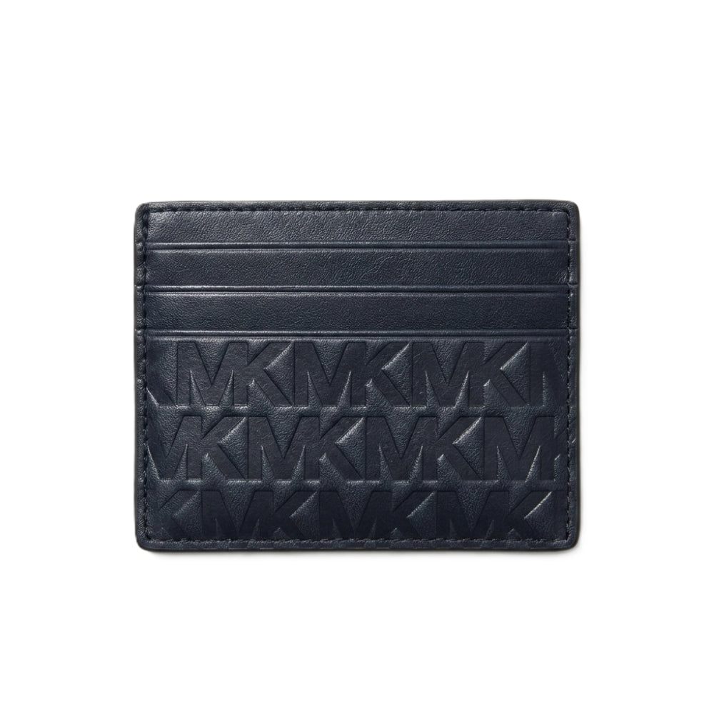 A dark navy blue leather cardholder wallet featuring an embossed repeating MK monogram pattern, shown against a plain white background.