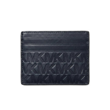 A dark navy blue leather cardholder wallet featuring an embossed repeating MK monogram pattern, shown against a plain white background.