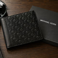 Michael_Kors_Hudson_Logo_Embossed_Leather_Billfold_Wallet_Black_-_Lifestyle
