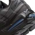 Close-up of a black Nike sneaker showing the textured synthetic leather upper, stitching, a tonal black Swoosh logo, and a translucent blue Air Max cushioning unit in the sole.