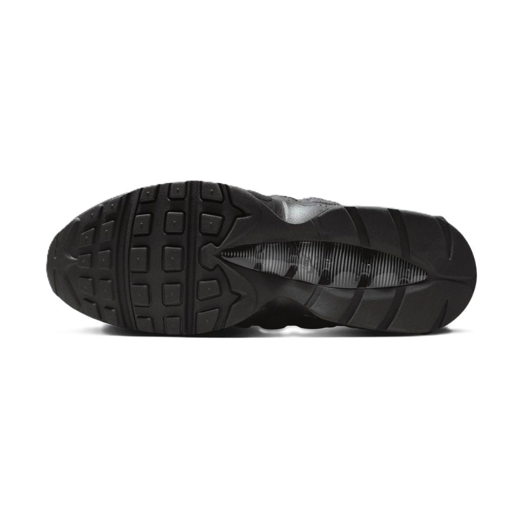 Black Adidas shoe sole on a white background