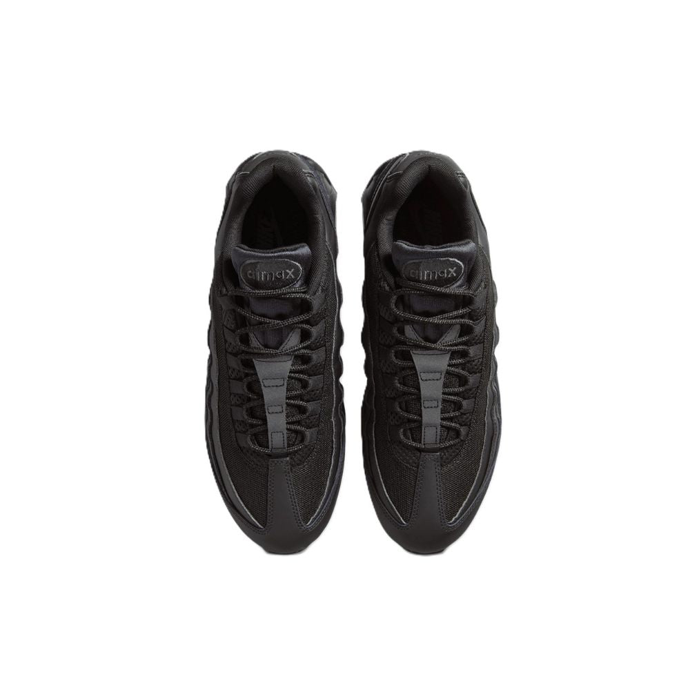 A pair of black Nike sneakers shown from a top-down view on a solid white background.