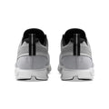 A pair of light gray and white running shoes shown from the back, featuring black accents on the collar and heel pull tabs, on a solid white background.