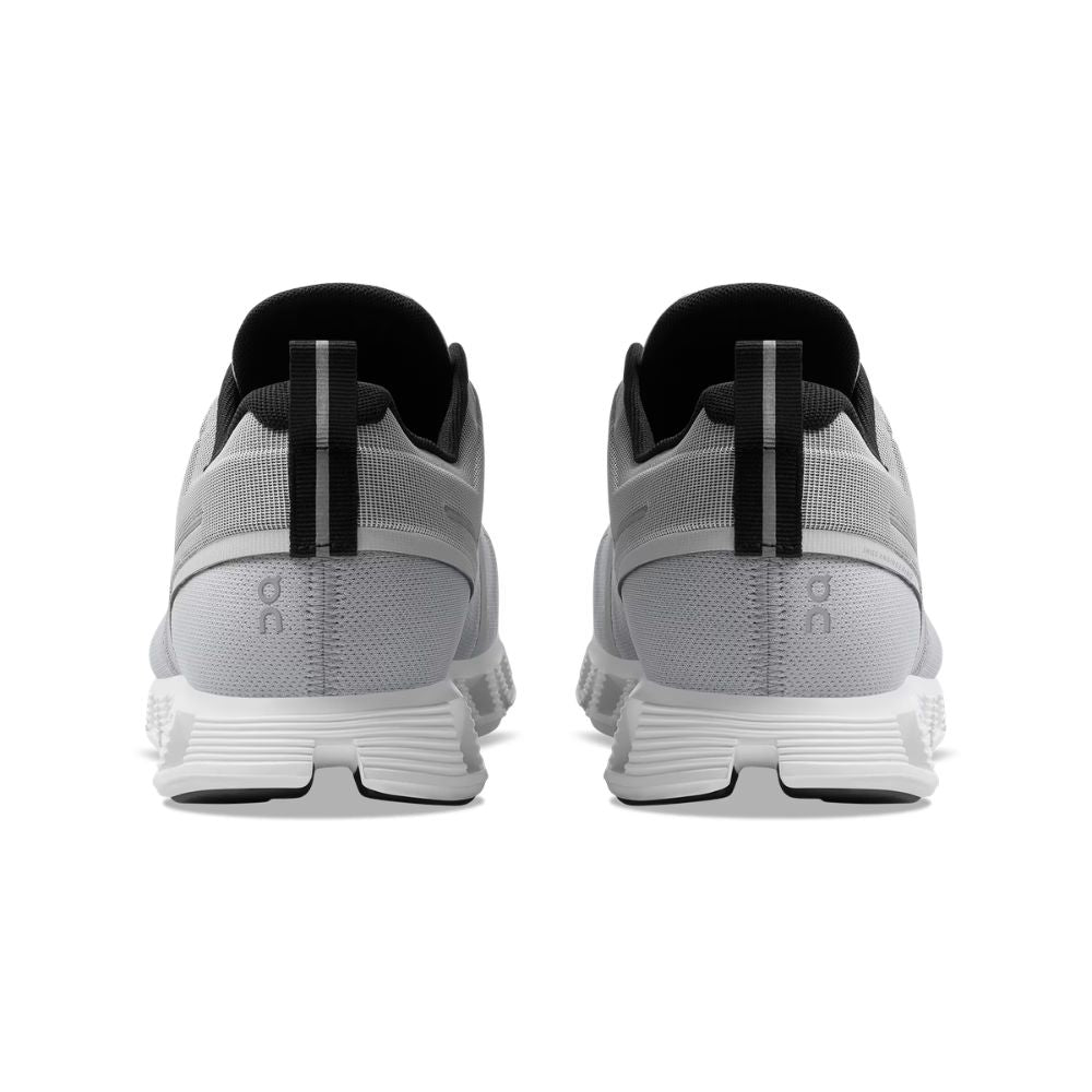 A pair of light gray and white running shoes shown from the back, featuring black accents on the collar and heel pull tabs, on a solid white background.