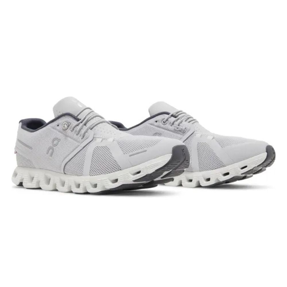 A pair of On Cloudrunning shoes in light gray and white, featuring a breathable mesh upper, cushioned midsole, and dark gray outsole, shown against a plain white background.