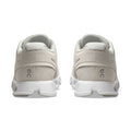 A pair of light beige running shoes shown from the back, featuring a breathable mesh upper, a thick white cushioned sole, and a small gray 'on' logo on the heel.