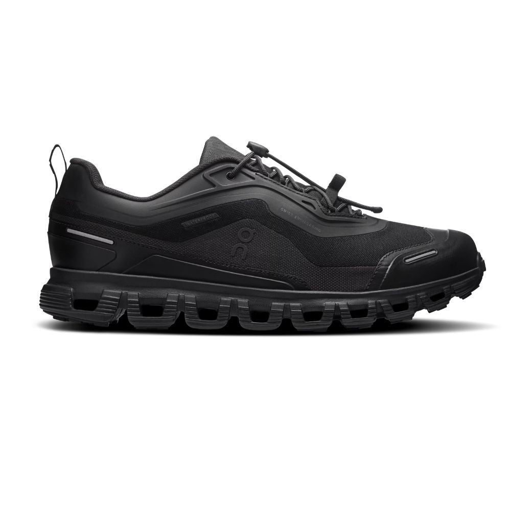 Black athletic shoe with pink accents on a white background
