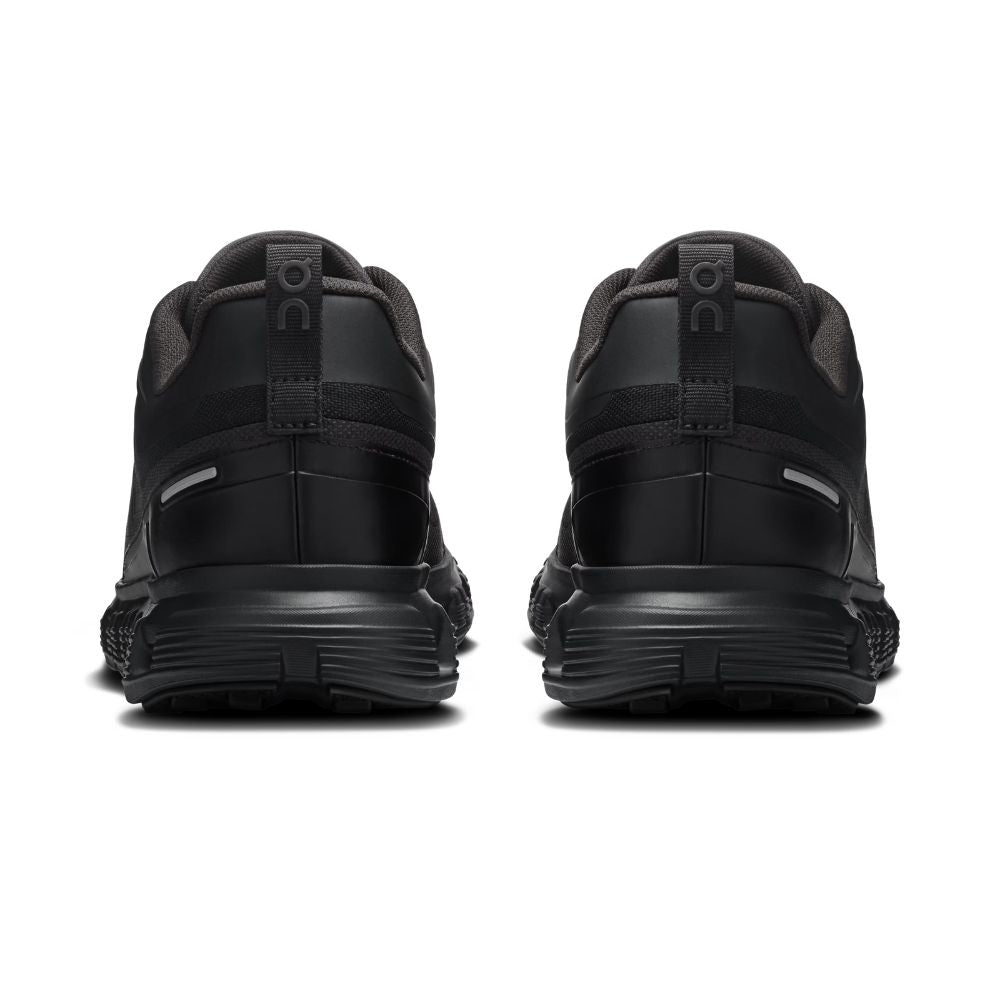 A pair of black athletic sneakers shown from the rear, featuring a chunky black sole and a pull tab with the 'on' logo, set against a plain white background.