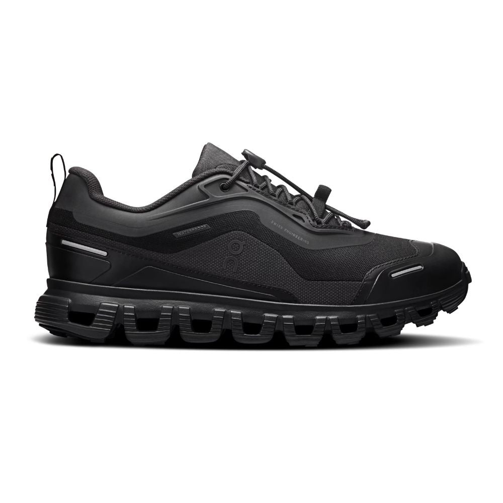 A black athletic sneaker with a chunky, sculpted black sole, shown in a side profile on a white background.