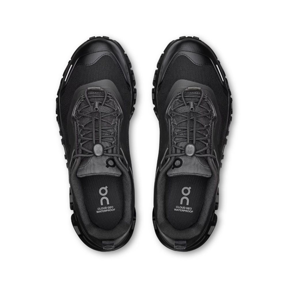 A pair of black On waterproof trail running shoes shown from a top-down view on a white background.