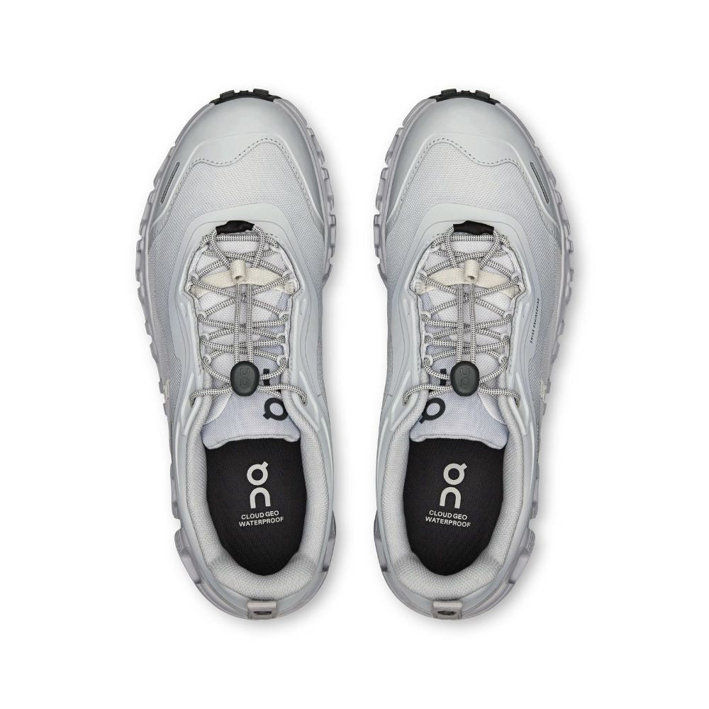 A pair of On running shoes in light gray and white with black accents, shown from a top-down view on a white background.